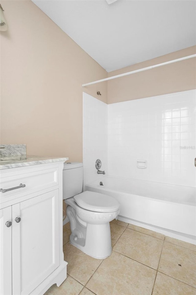 full bathroom with toilet, tile patterned flooring, vanity, and  shower combination