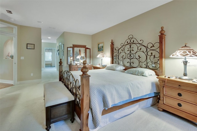 bedroom with light colored carpet