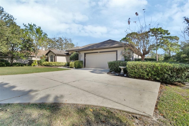 ranch-style home with a front yard and a garage