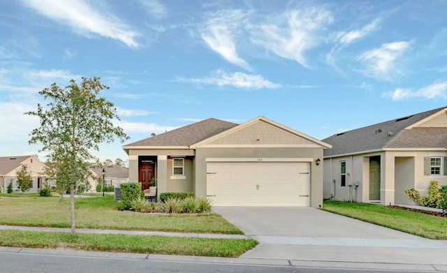 view of front of house with a garage and a front yard