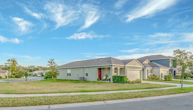 ranch-style home with a garage and a front lawn