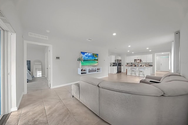 living room with light tile patterned floors