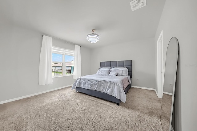 bedroom with light colored carpet