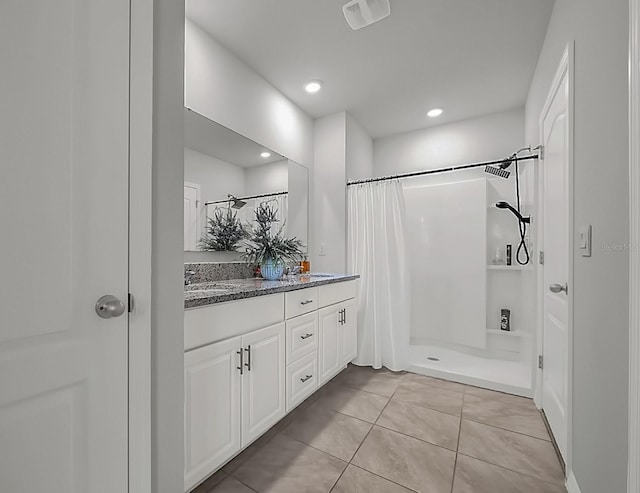 bathroom featuring tile patterned floors, a shower with curtain, and vanity