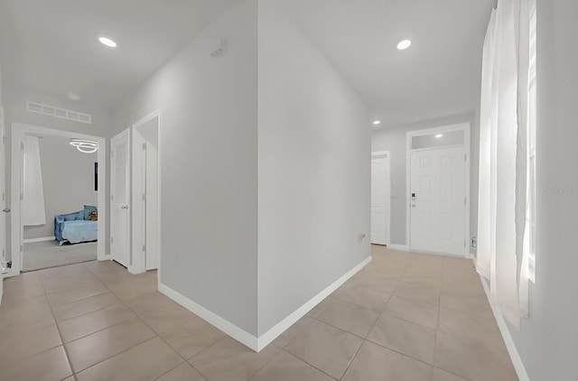 hallway with light tile patterned floors