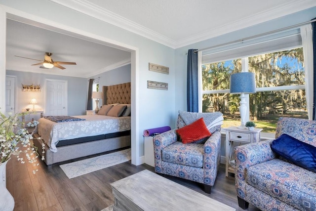 bedroom featuring ceiling fan, multiple windows, crown molding, and dark wood-type flooring