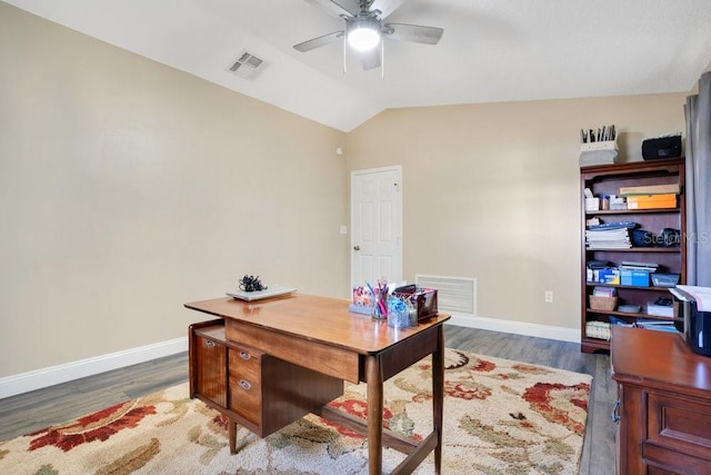 office area featuring dark hardwood / wood-style floors, ceiling fan, and vaulted ceiling