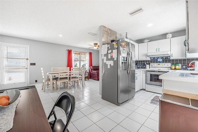 kitchen with backsplash, electric stove, stainless steel refrigerator with ice dispenser, ceiling fan, and white cabinetry