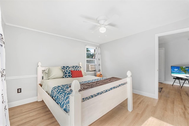 bedroom featuring ceiling fan, cooling unit, and wood-type flooring