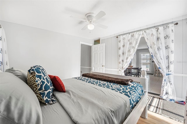 bedroom featuring ceiling fan and wood-type flooring