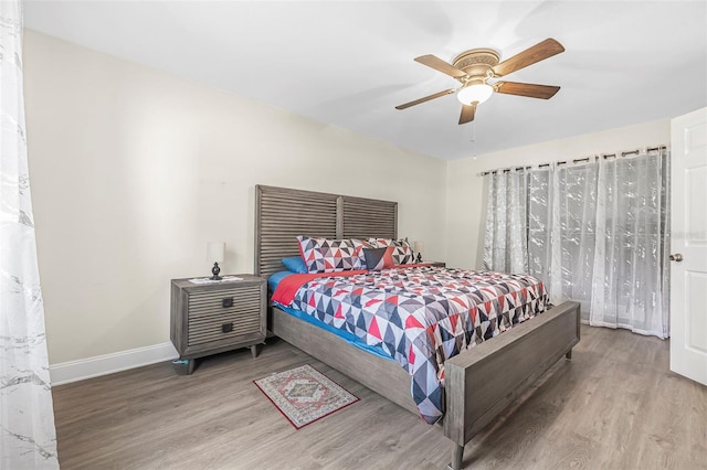 bedroom featuring ceiling fan and wood-type flooring