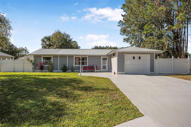 ranch-style home featuring a front lawn and a garage