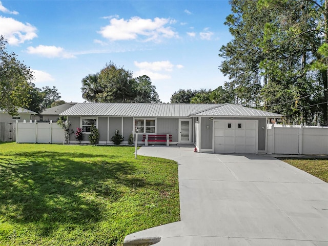 ranch-style home featuring a front yard and a garage