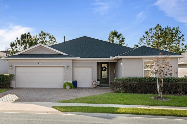 ranch-style house with a front yard and a garage