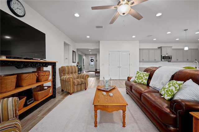 living room featuring ceiling fan