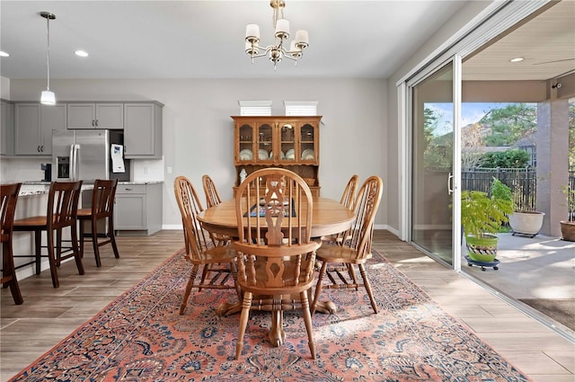 dining area with an inviting chandelier