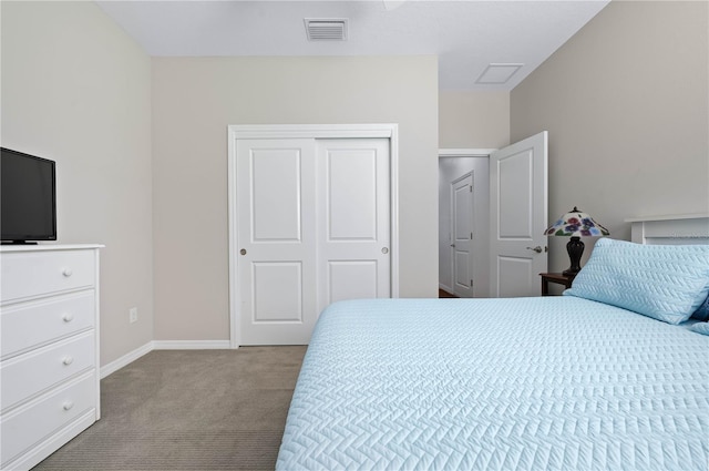 carpeted bedroom with a closet