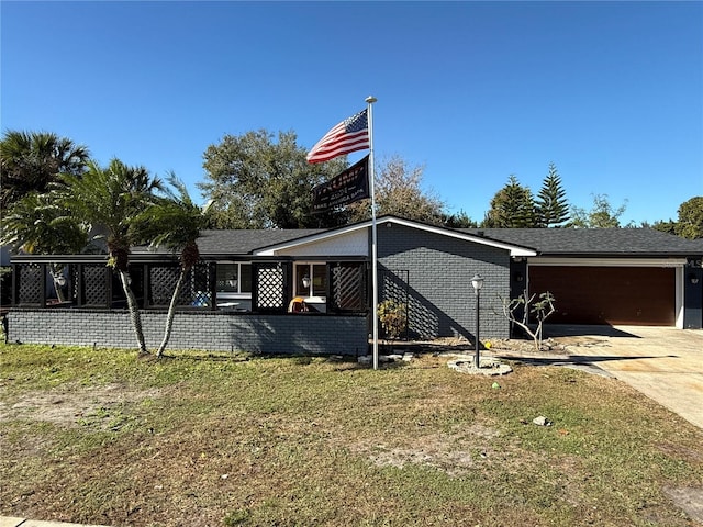 view of home's exterior featuring a garage and a lawn