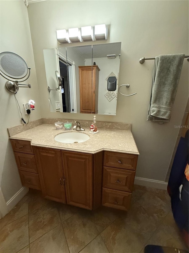 bathroom with vanity and tile patterned floors