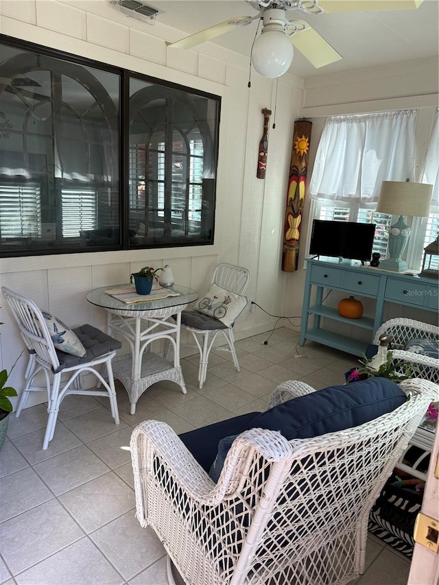 interior space with ceiling fan and a healthy amount of sunlight