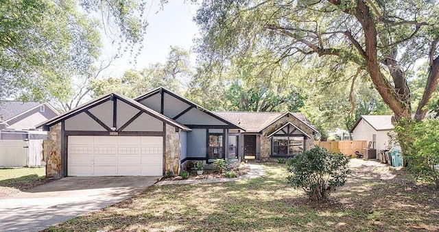 tudor home featuring a garage