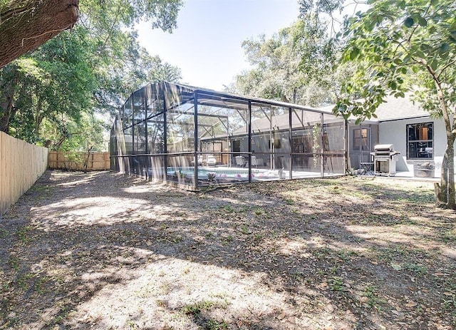 view of yard featuring a lanai