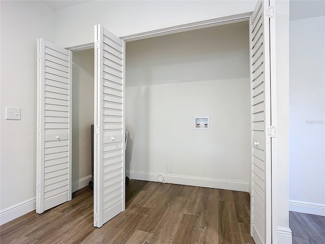 washroom featuring dark hardwood / wood-style floors and hookup for a washing machine