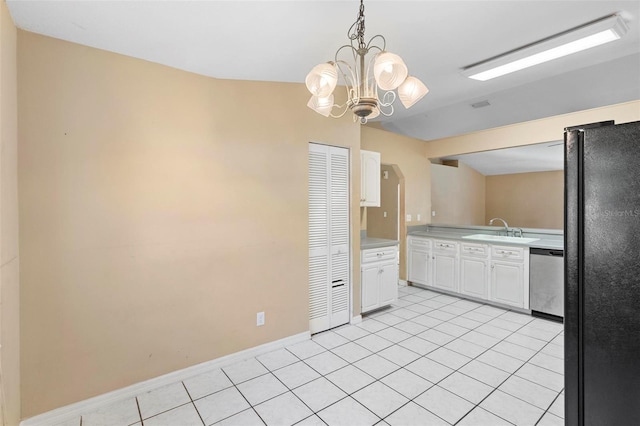 kitchen featuring black refrigerator, sink, white cabinets, and stainless steel dishwasher