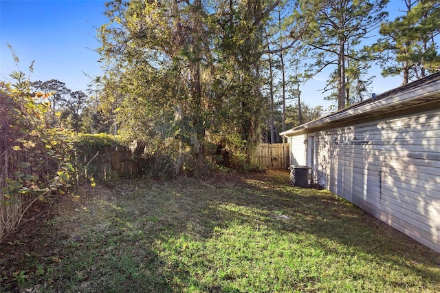 view of yard featuring central air condition unit