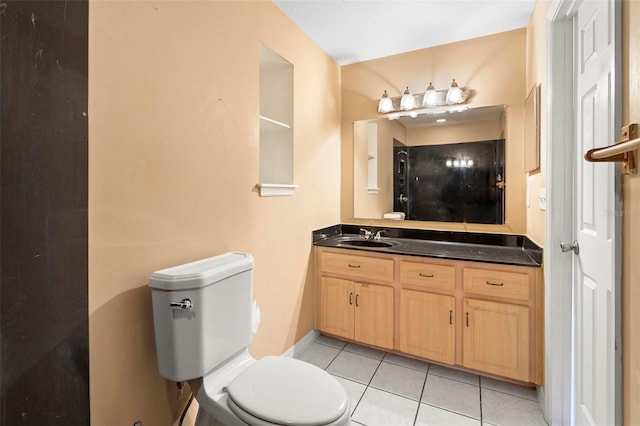 bathroom with tile patterned floors, vanity, and toilet