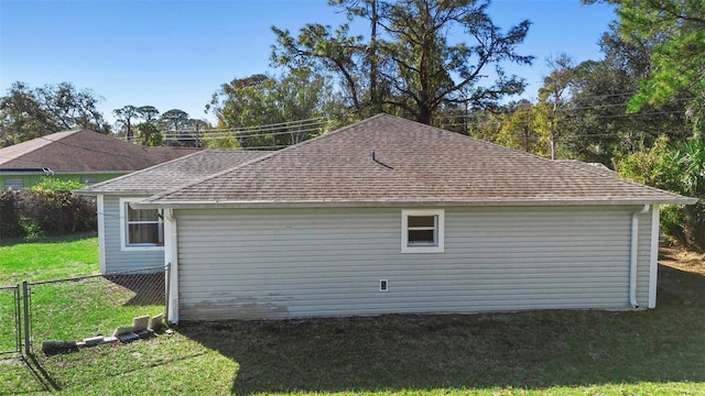 view of side of property with a yard