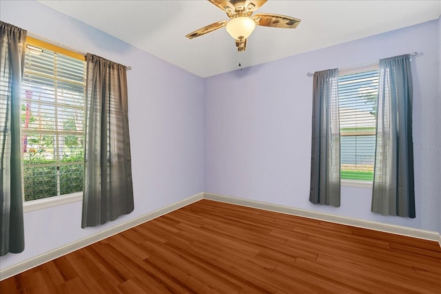 spare room featuring ceiling fan and hardwood / wood-style floors