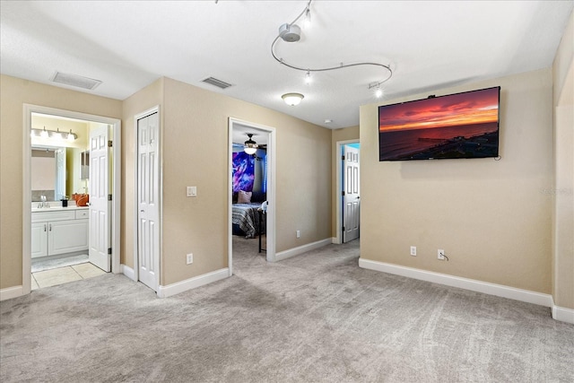 unfurnished room with light colored carpet