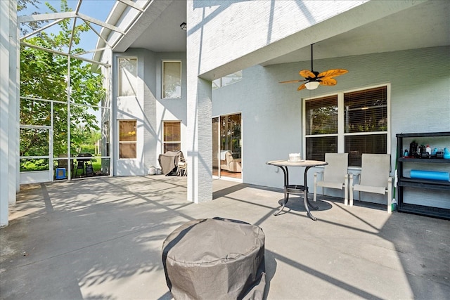 view of patio / terrace with glass enclosure and ceiling fan