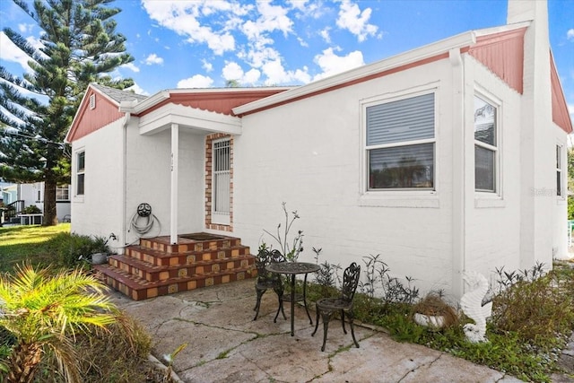 rear view of house featuring a patio