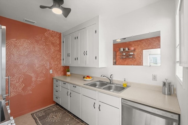 kitchen with dishwasher, white cabinets, ceiling fan, and sink