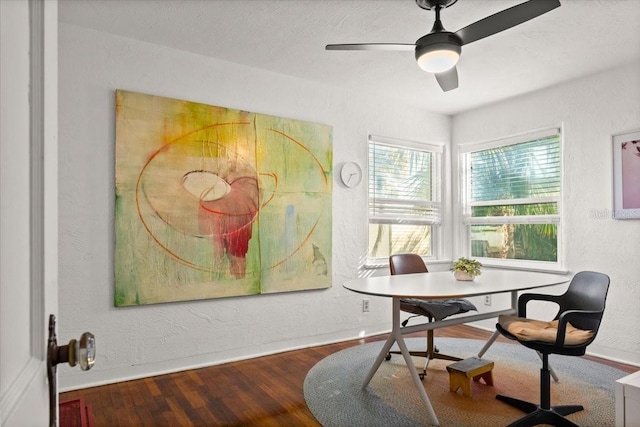 dining space with wood-type flooring and ceiling fan