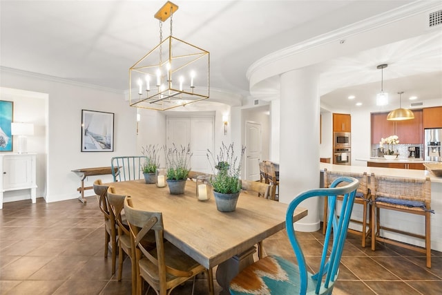 tiled dining area with a notable chandelier and ornamental molding