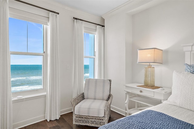 bedroom featuring a water view, dark hardwood / wood-style floors, and crown molding