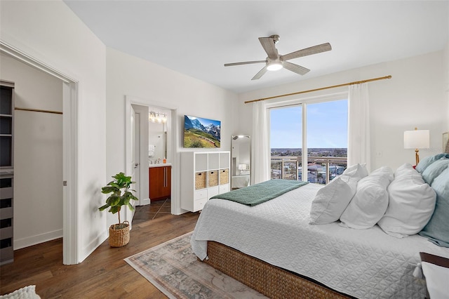 bedroom with ensuite bathroom, dark hardwood / wood-style flooring, and ceiling fan