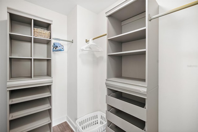 walk in closet featuring hardwood / wood-style flooring