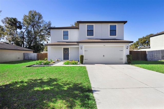 view of property featuring a front lawn and a garage