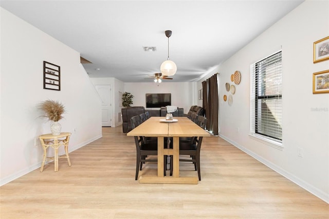 dining area featuring light hardwood / wood-style flooring and ceiling fan