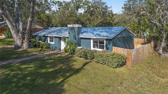 ranch-style house with a front yard