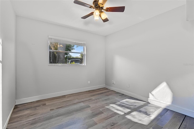 spare room with light hardwood / wood-style floors and ceiling fan