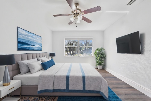 bedroom featuring ceiling fan and dark hardwood / wood-style flooring