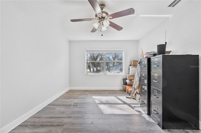 interior space featuring ceiling fan and hardwood / wood-style floors