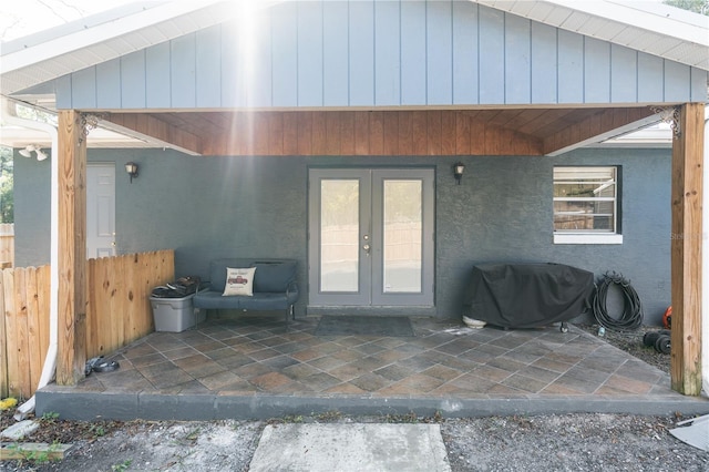 entrance to property with french doors and a patio area