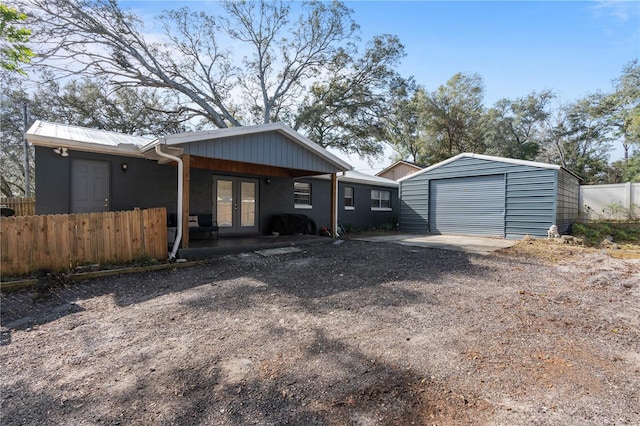 exterior space featuring french doors and a garage