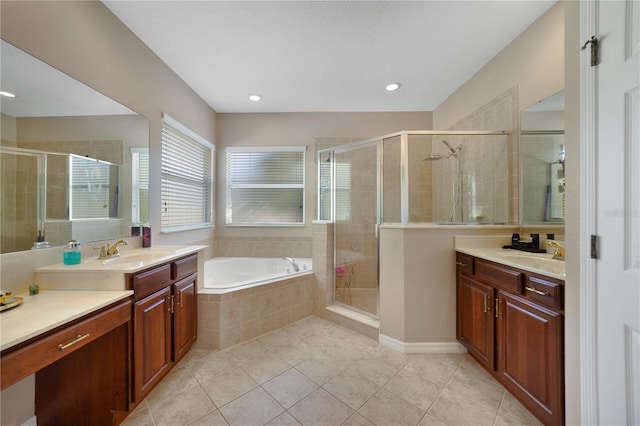 bathroom with tile patterned flooring, vanity, and independent shower and bath